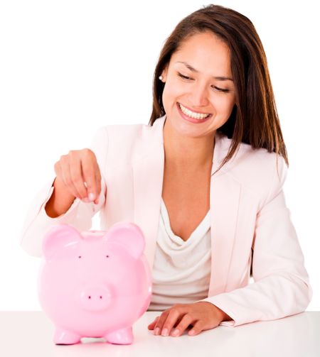 Woman saving money in a piggybank - isolated over a white backgorund