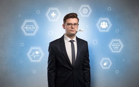 Young businessman with medical care, pills concept