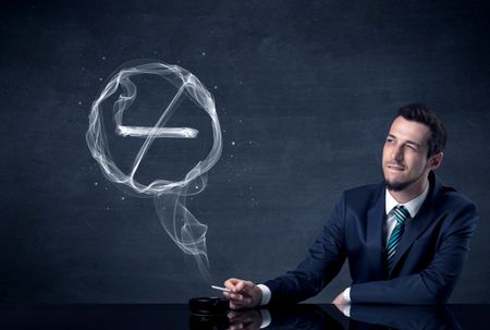 Businessman smoking cigarette and the smoke forms a no smoking sign.