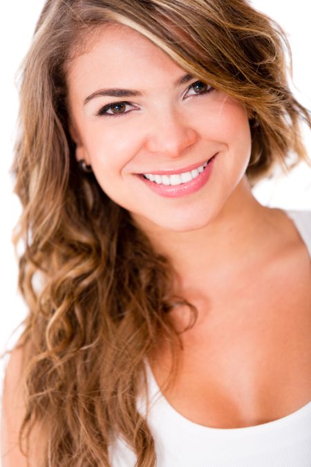 Beautiful young woman looking happy - isolated over a white background