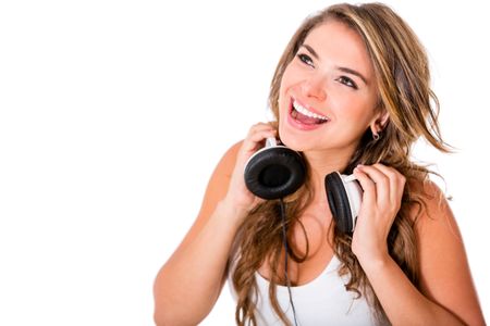 Happy woman with headphones - isolated over a white background