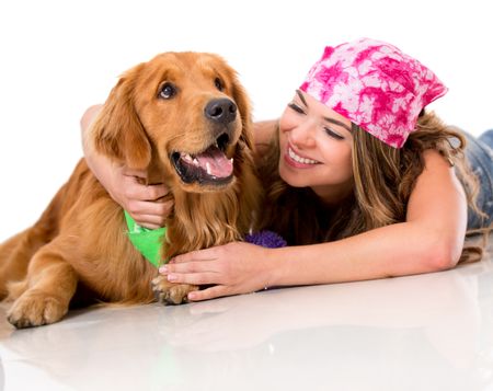 Woman lying on the floor with her dog looking happy