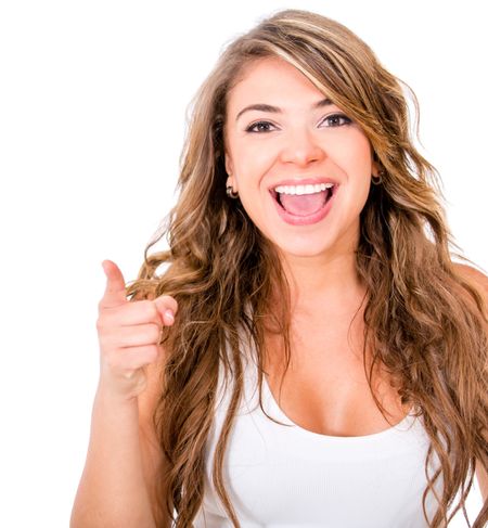 Happy woman pointing at the camera - isolated over a white background