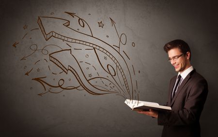 Casual young man holding book with brown arrows and stars flying out of it