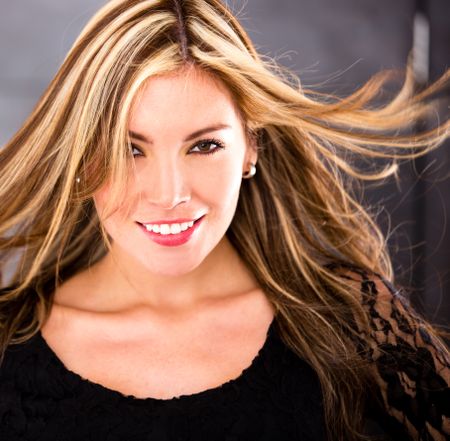 Sexy female portrait with wind in her hair