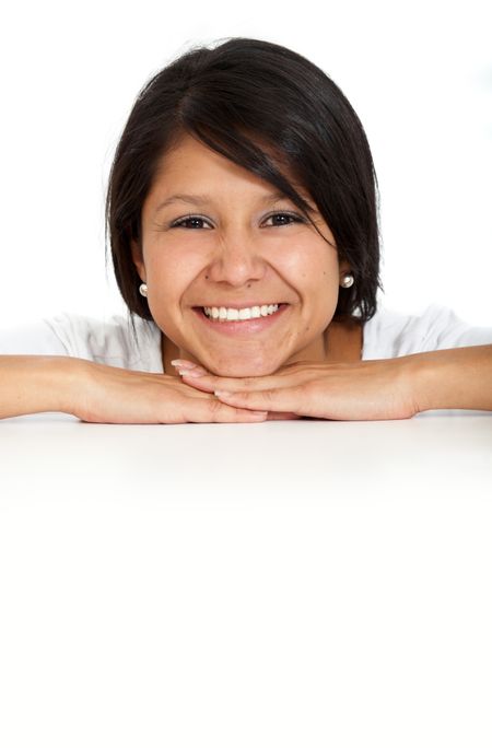 casual woman smiling on the floor isolated over a white background