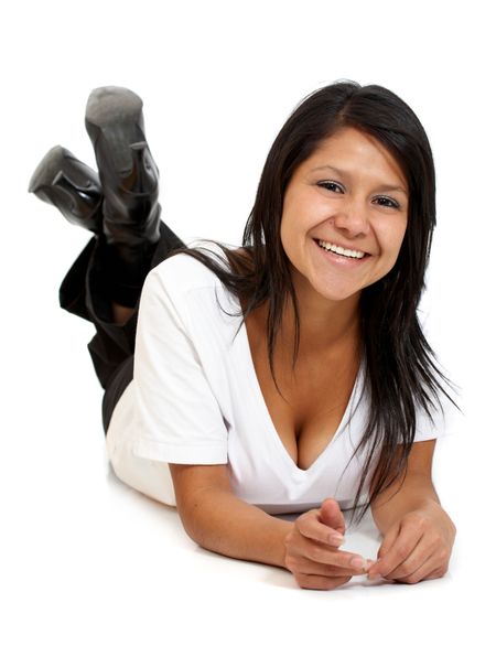 casual woman smiling on the floor isolated over a white background