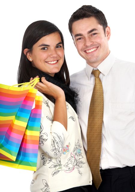 happy couple shopping isolated over a white background