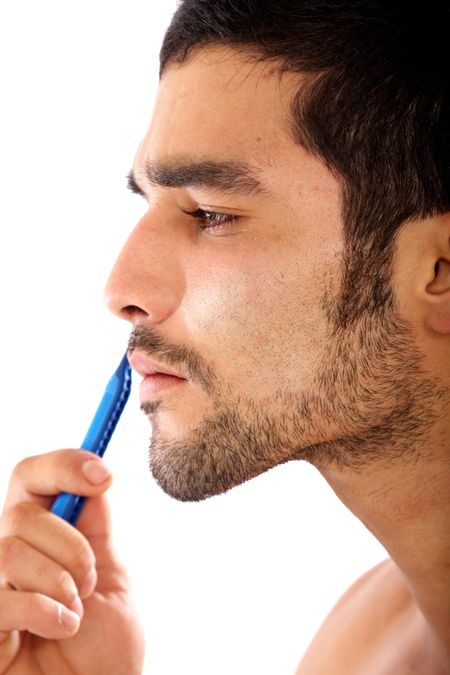 man shaving his beard isolated over a white background
