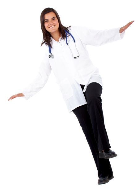 doctor balancing isolated over a white background
