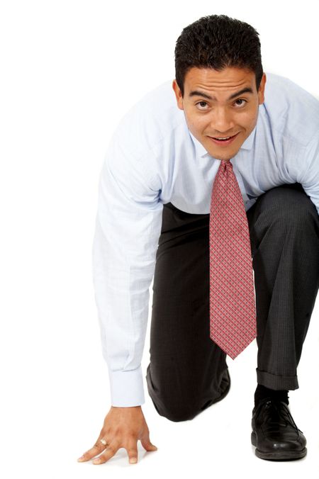 Business man ready to race against the competition isolated over a white background