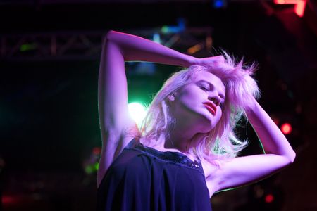 attractive-young-woman-dancing-nightclub-119228194 Attractive young woman dancing in a nightclub