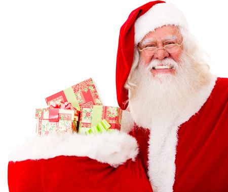 Happy Santa with Christmas gifts in a sack - isolated over white