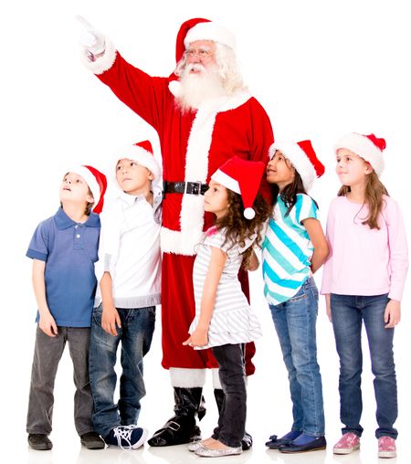 Santa pointing away and showing something to a group of kids - isolated
