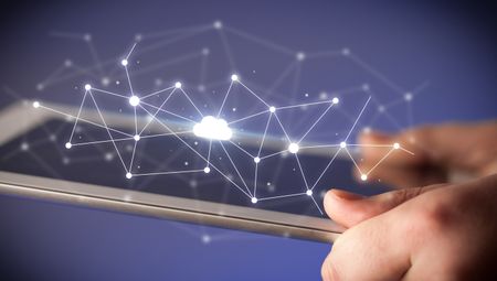 Female hands touching tablet with white cloud concept