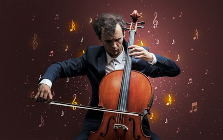 Young cellist with falling musical notes wallpaper and classical concept