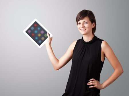 beautiful woman holding modern tablet with colorful icons