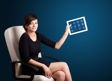 beautiful woman holding modern tablet with colorful icons