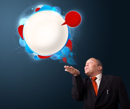 funny businessman in suit presenting abstract modern speech bubble copy space