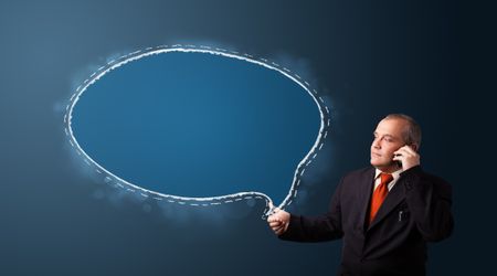 businessman in suit making phone call and presenting speech bubble copy space