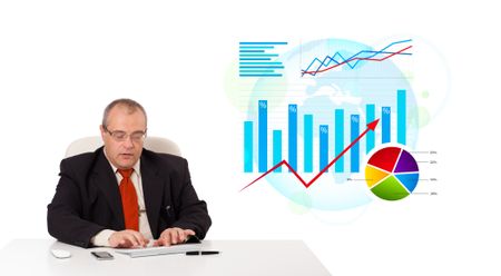 Businessman sitting at desk with statistics, isolated on white