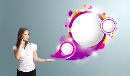 Pretty young woman presenting abstract speech bubble copy space and making phone call
