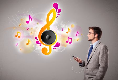 young man singing and listening to music with musical notes getting out of his mouth