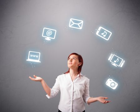 pretty girl standing and juggling with elecrtonic devices icons