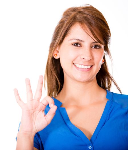 Happy woman with an ok sign - isolayed over a white background