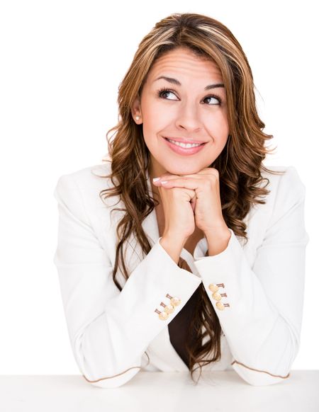 Thoughtful business woman looking up - isolated over a white background