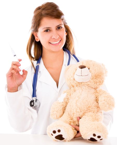 Pediatrician with a vaccine for a teddy bear - isolated over a white background