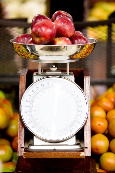 Apples on a weight scale at the supermarket