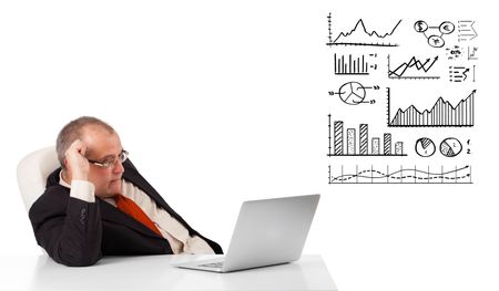 businessman sitting at desk with graphs and laptop, isolated on white