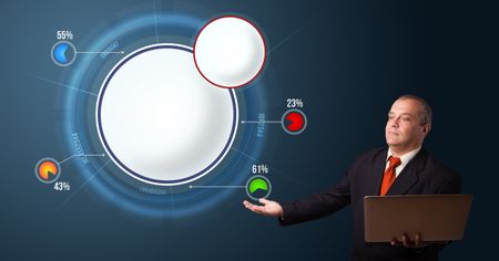 businessman in suit holding a laptop and presenting abstract modern pie chart with copy space