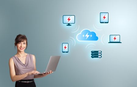 Beautiful young woman holding a laptop and presenting cloud computing network