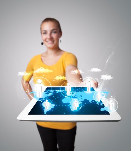Beautiful young woman holding modern tablet with social icons