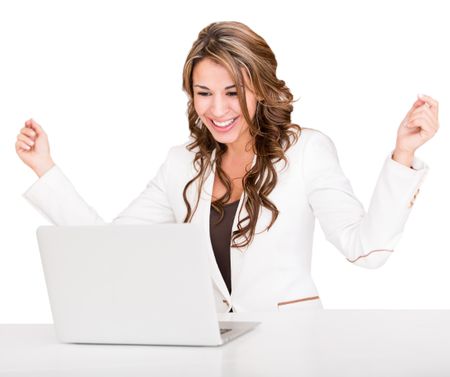 Succesful businesswoman with a laptop and arms up - isolated over white