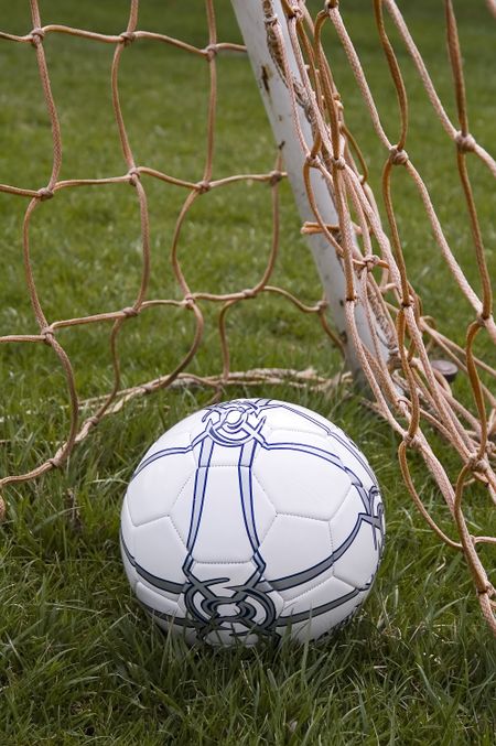 Soccer ball in corner of goal