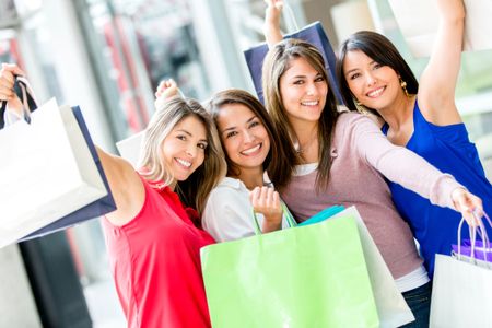 Excited female shoppers at the shopping center