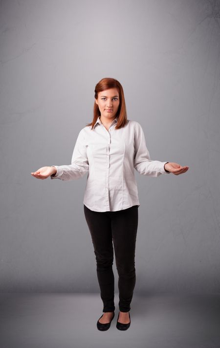 beautiful young lady standing and juggling with copy space