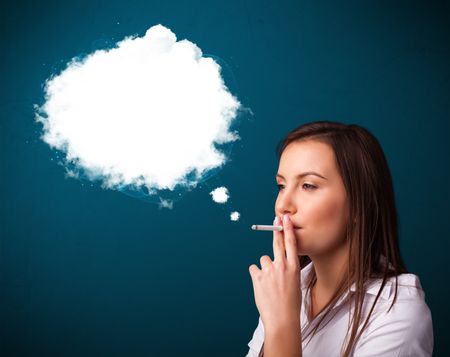 Pretty young woman smoking unhealthy cigarette with dense smoke