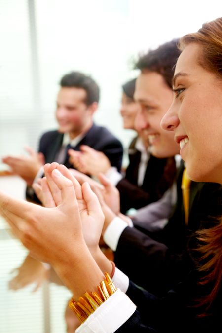 business team clapping a good presentation in an office