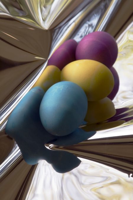 Three Easter eggs and distorted reflections