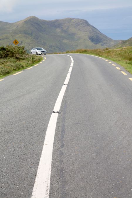 Car on Open Road; Killary Fjord; Connemara National Park; Ireland