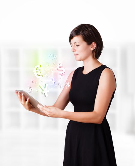 Young  woman looking at modern tablet with currency icons