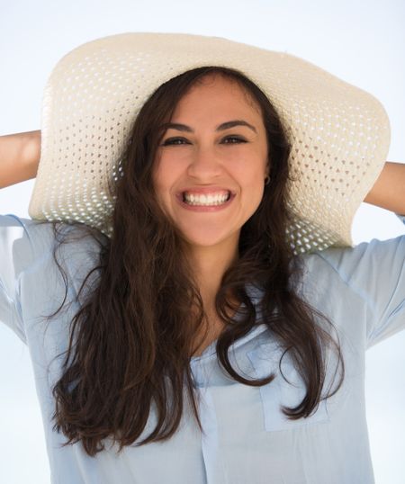 Happy summer woman enjoying her vacations and smiling