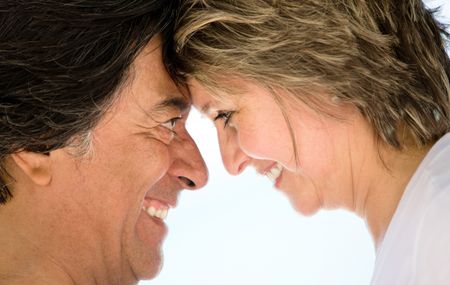 Closeup portrait of a loving couple smiling