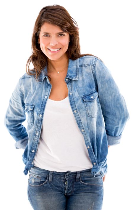 Beautiful woman in denim and smiling - isolated over white