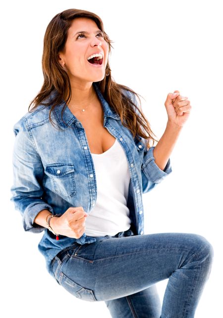 Woman enjoying her victory and celebrating - isolated over white background
