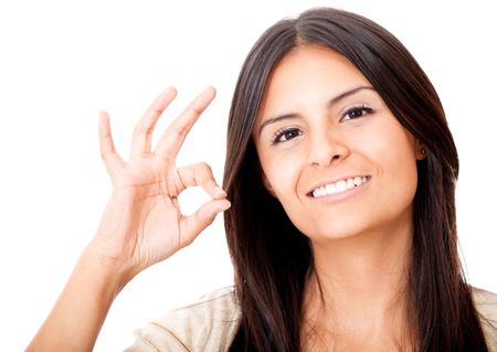 Woman making an ok sign - isolated over a white background